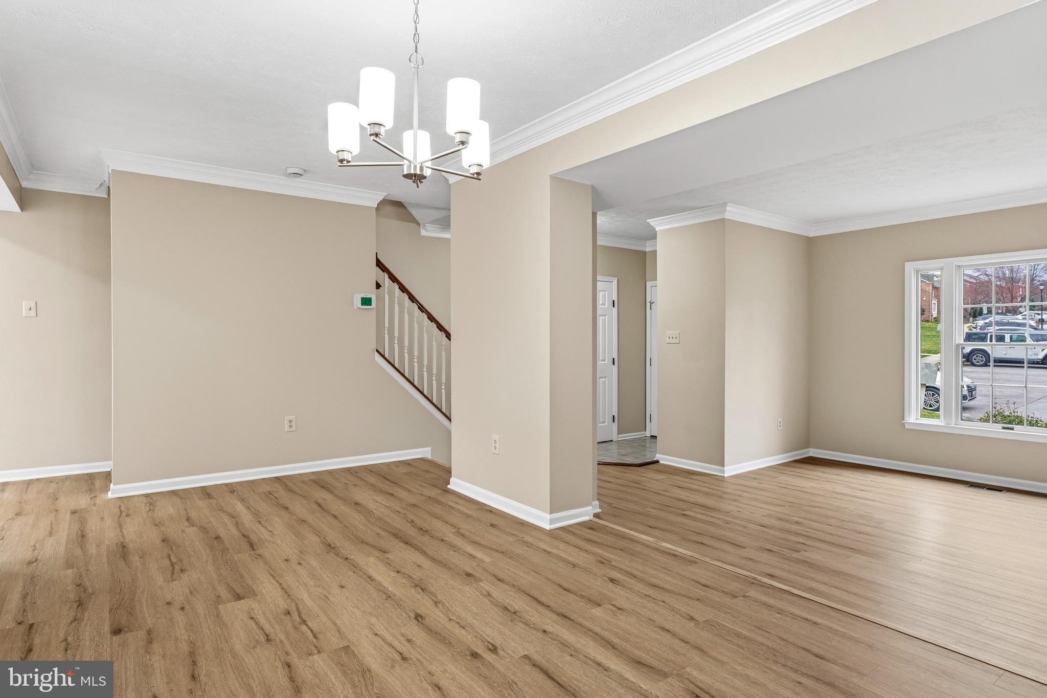 2717 Quarry Heights Way Baltimore, MD 21209 - Photo 13 of 58 a view of a livingroom with wooden floor and a ceiling fan