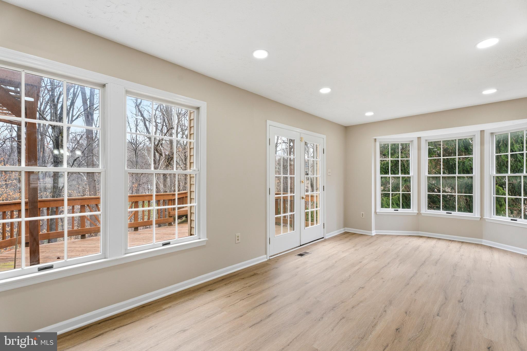 2717 Quarry Heights Way Baltimore, MD 21209 - Photo 18 of 58 a view of an empty room with a window and wooden floor