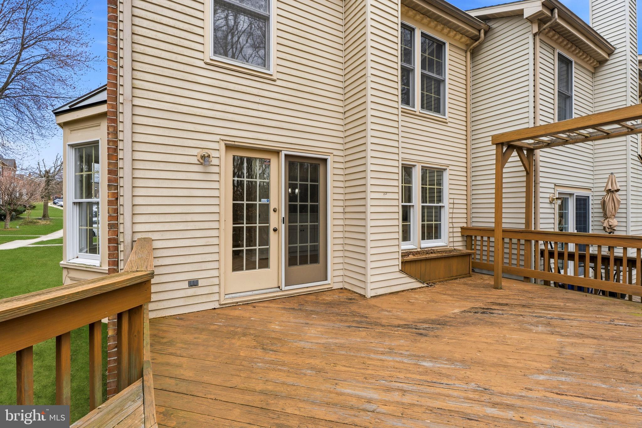 2717 Quarry Heights Way Baltimore, MD 21209 - Photo 25 of 58 a view of a house with a wooden deck
