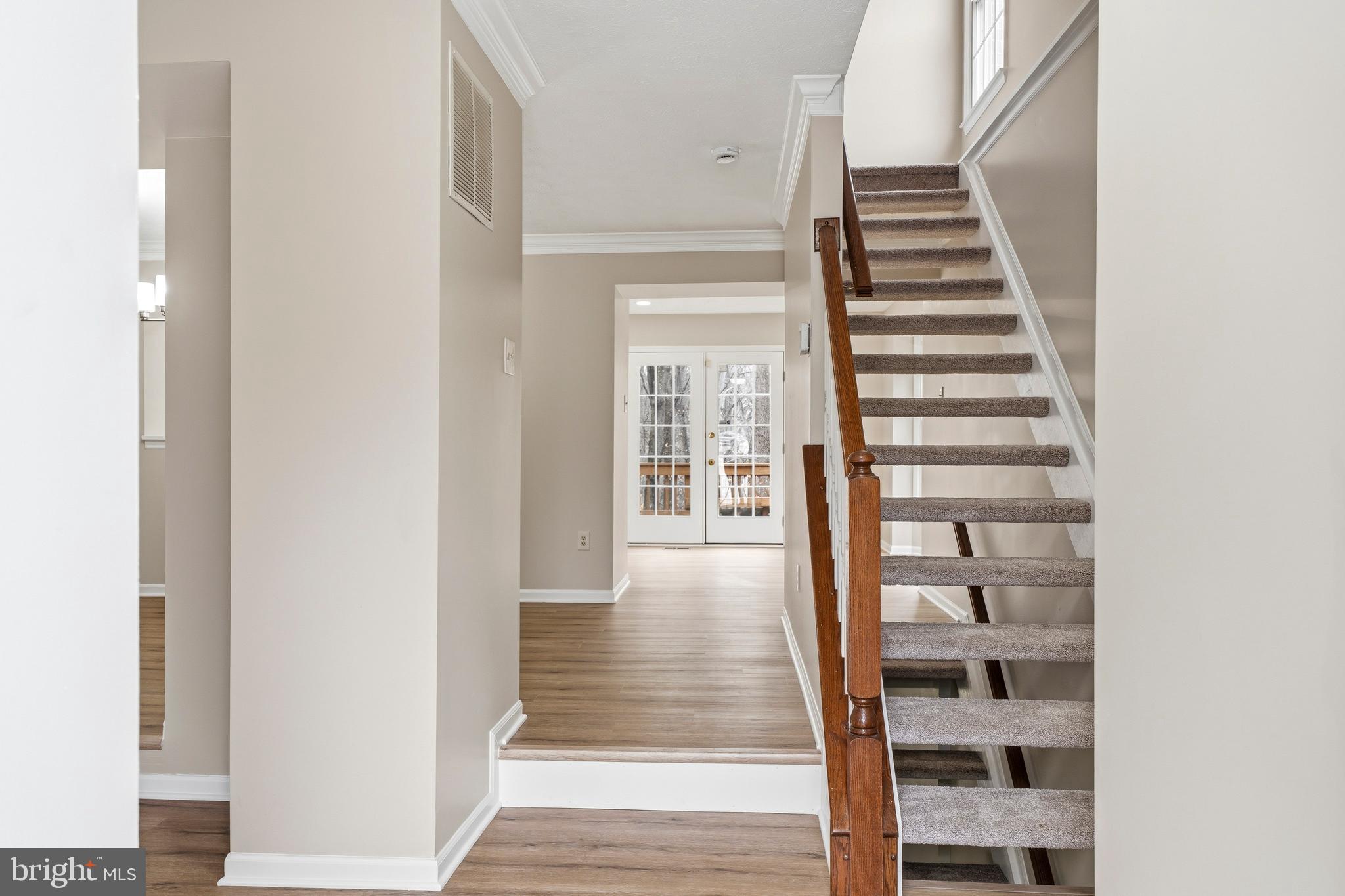 2717 Quarry Heights Way Baltimore, MD 21209 - Photo 26 of 58 a view of a hallway with wooden floor and windows