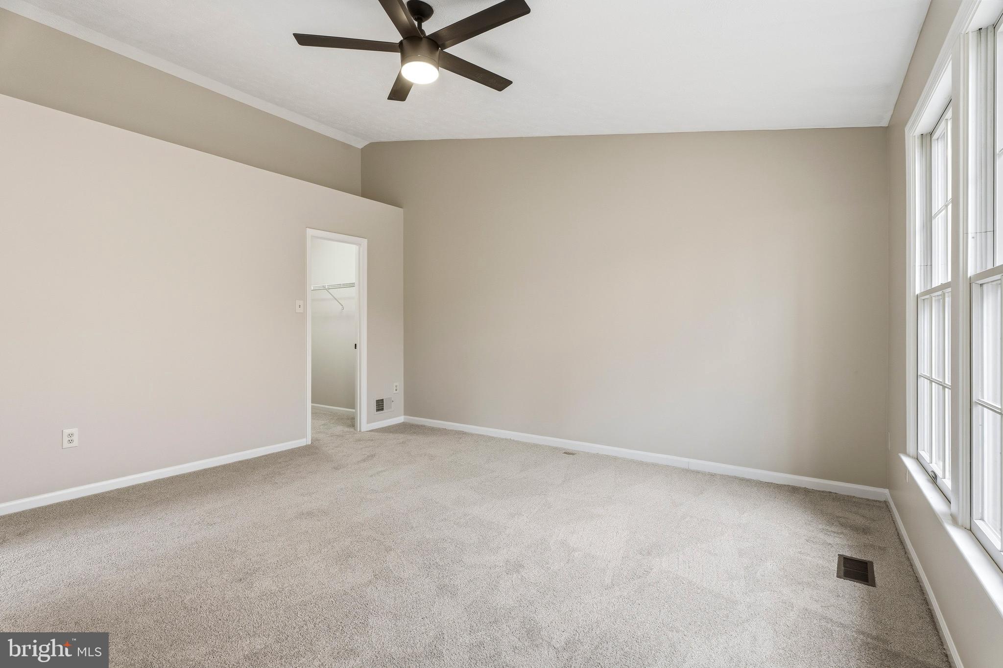 2717 Quarry Heights Way Baltimore, MD 21209 - Photo 30 of 58 an empty room with a window and a fan