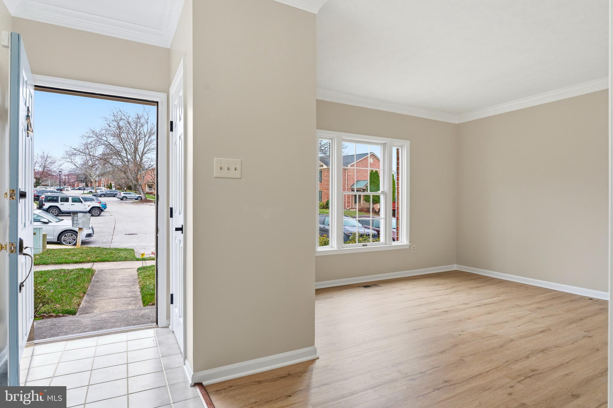 2717 Quarry Heights Way Baltimore, MD 21209 - Photo 3 of 58 wooden floor in an empty room with a window