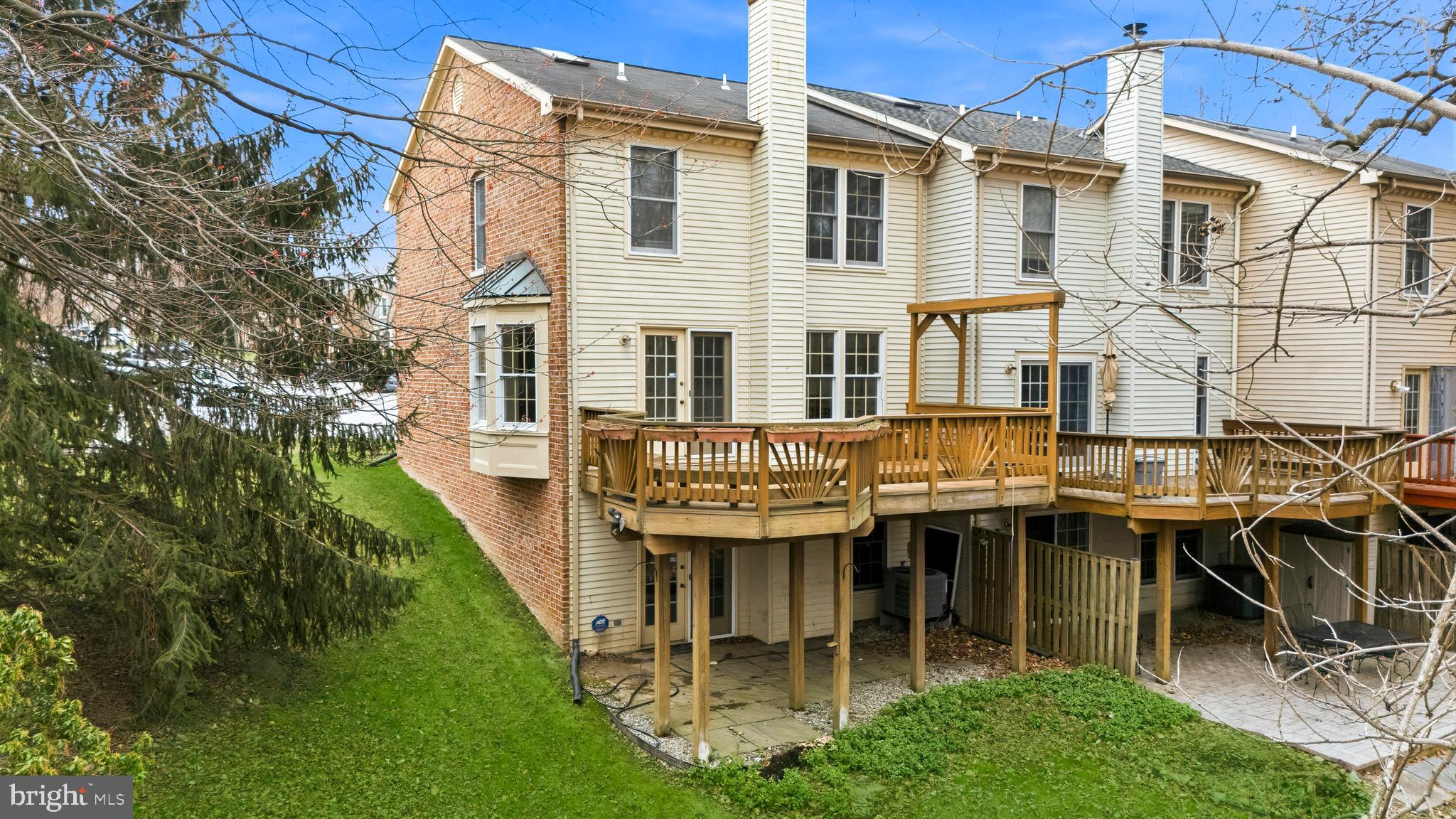 2717 Quarry Heights Way Baltimore, MD 21209 - Photo 56 of 58 a view of a building with a yard chairs and table in the patio