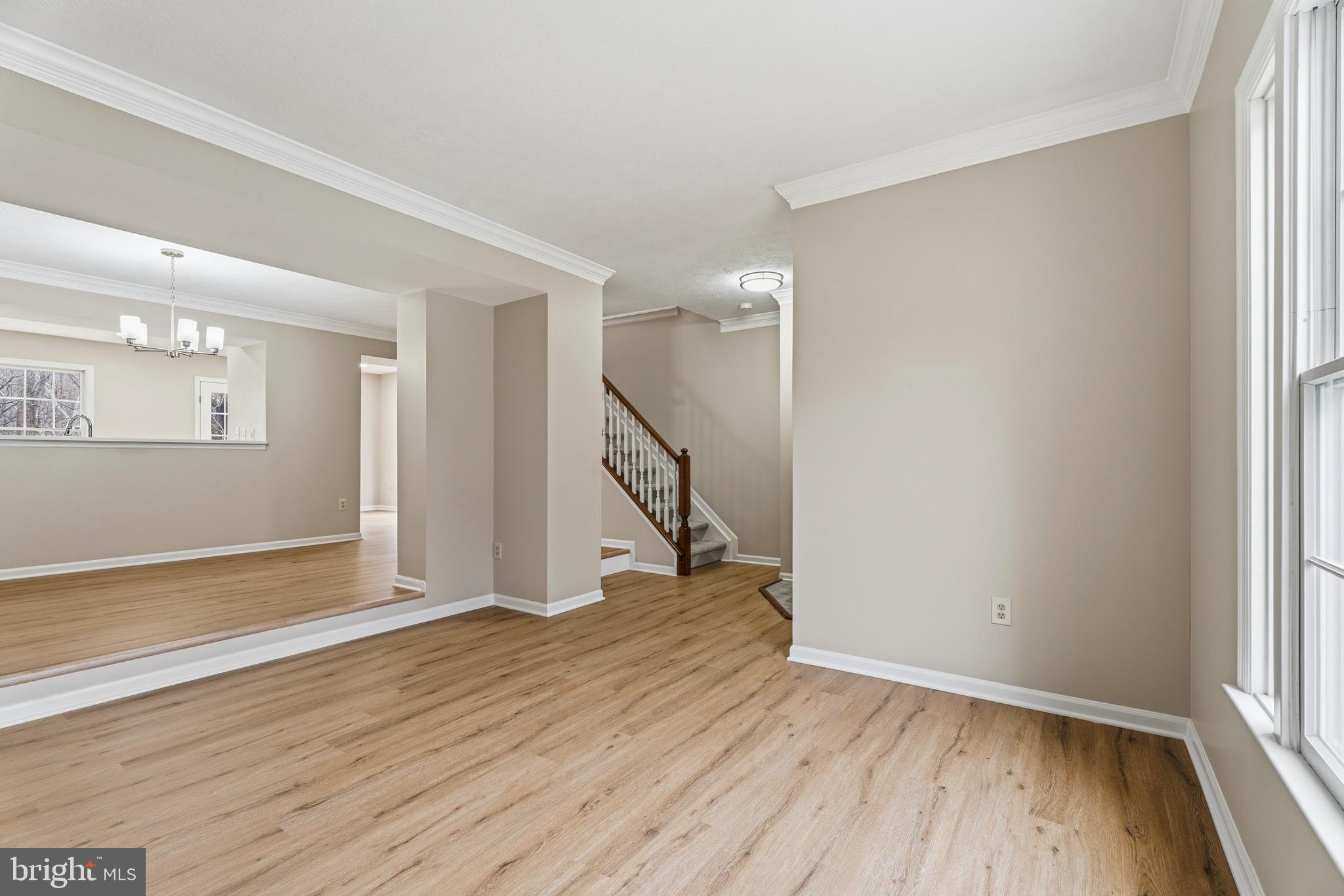 2717 Quarry Heights Way Baltimore, MD 21209 - Photo 7 of 58 a view of empty room with wooden floor and fan