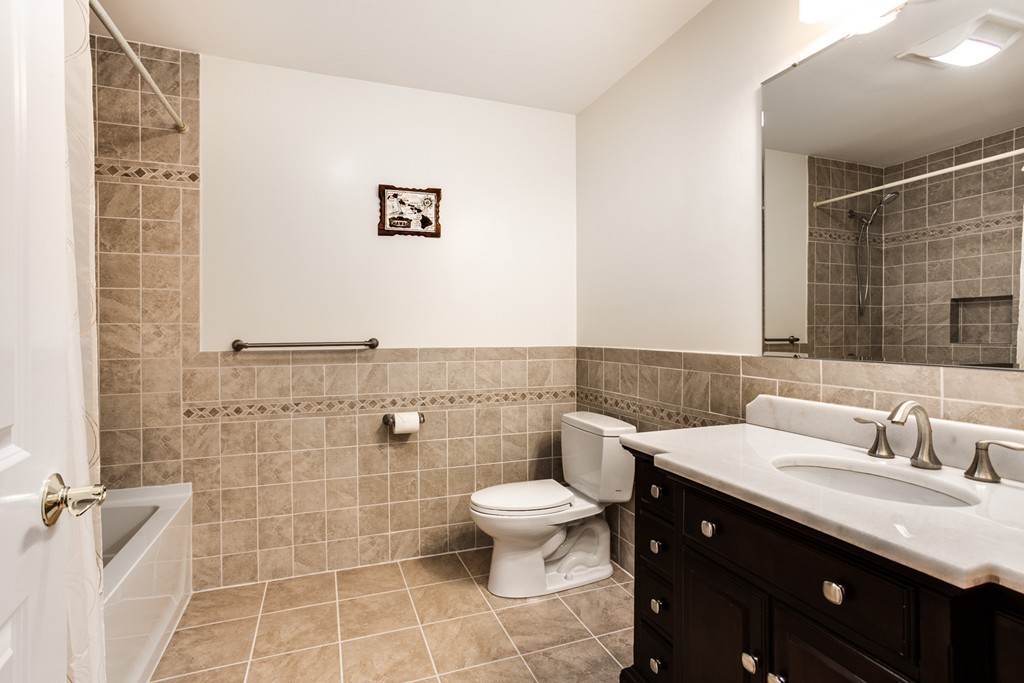 146 Pine Street Dover, MA 02030 - Photo 20 of 30 a bathroom with a double vanity sink toilet and a mirror