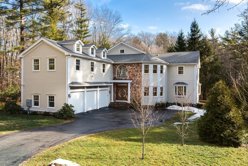146 Pine Street Dover, MA 02030 - Photo 2 of 30 a front view of a house with a yard