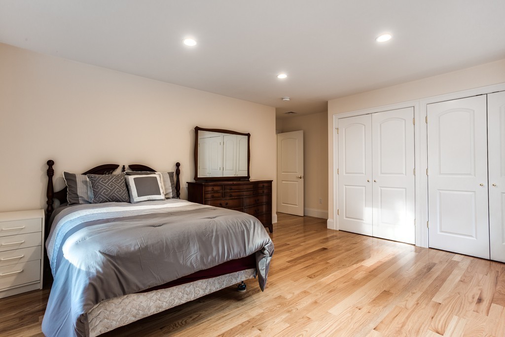 146 Pine Street Dover, MA 02030 - Photo 21 of 30 a bedroom with a bed and a mirror