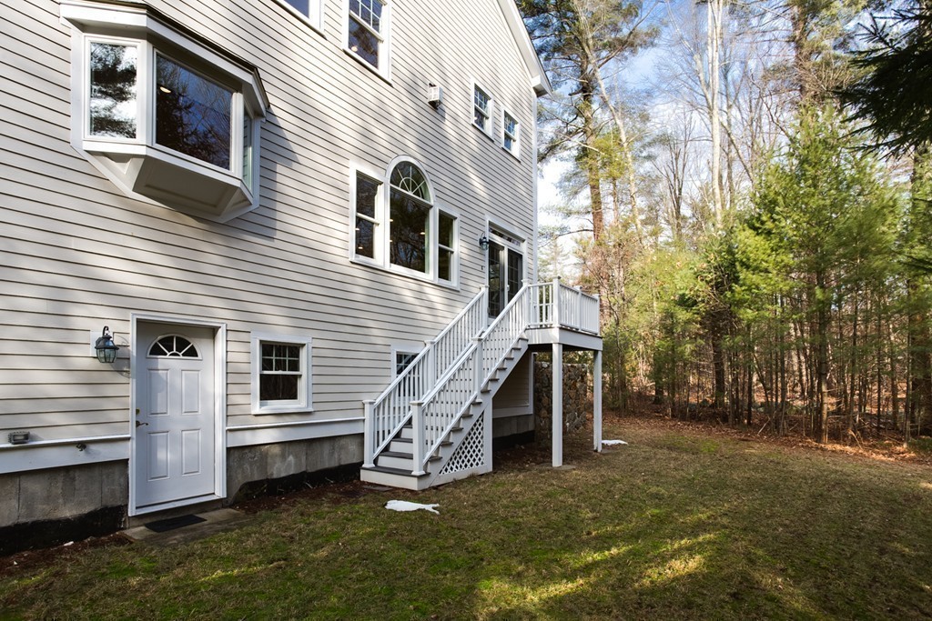 146 Pine Street Dover, MA 02030 - Photo 27 of 30 a view of a house with a yard