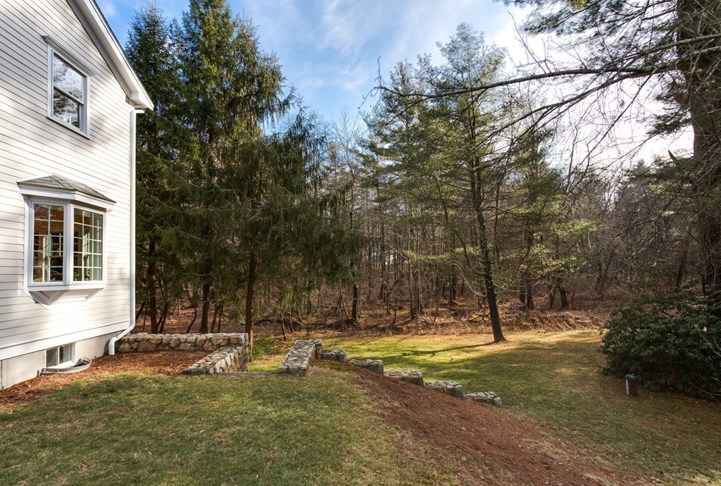 146 Pine Street Dover, MA 02030 - Photo 28 of 30 a view of a house with a yard