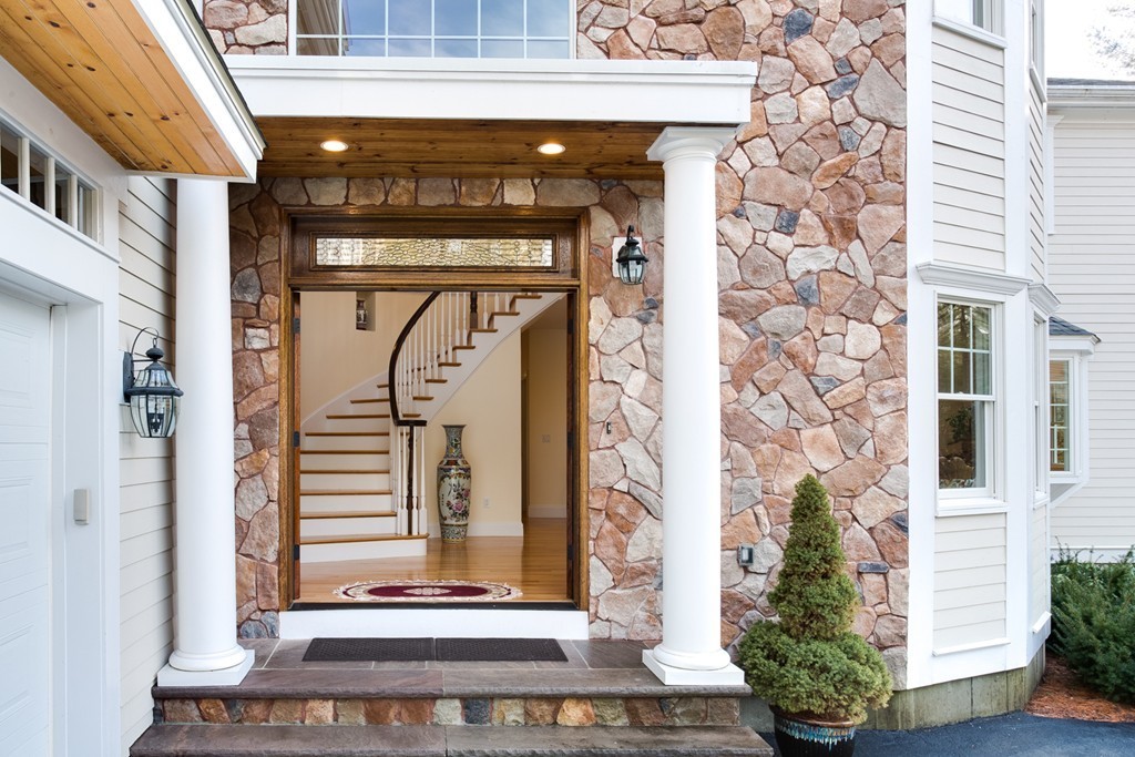 146 Pine Street Dover, MA 02030 - Photo 3 of 30 a front view of a building with a garden