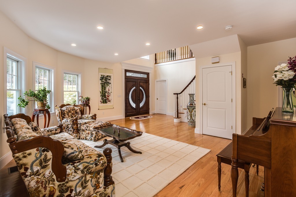 146 Pine Street Dover, MA 02030 - Photo 5 of 30 a living room with furniture a clock and wooden floor