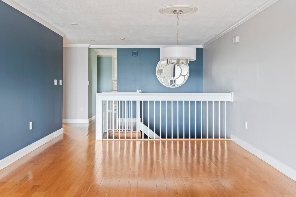 65 Lake Avenue, Unit 831 Worcester, MA 01604 - Photo 15 of 39 a view of a hallway with a chandelier
