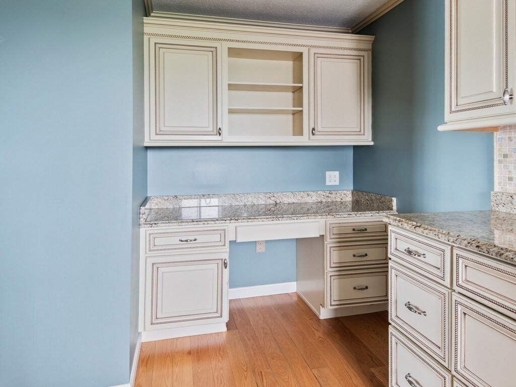 65 Lake Avenue, Unit 831 Worcester, MA 01604 - Photo 19 of 39 a kitchen with granite countertop white cabinets and white appliances