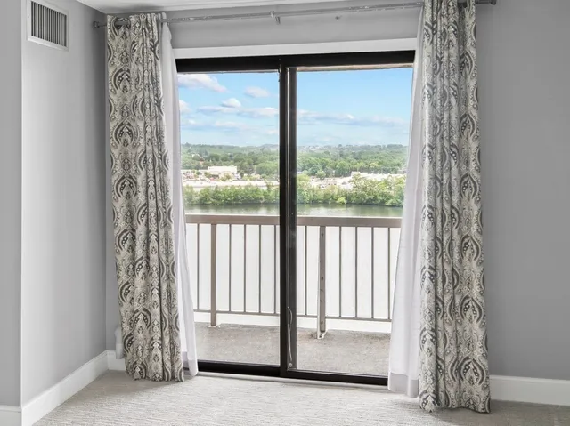 a view of an empty room with a window