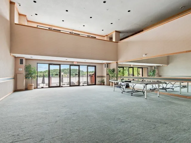 a kitchen with cabinets stainless steel appliances and a counter space
