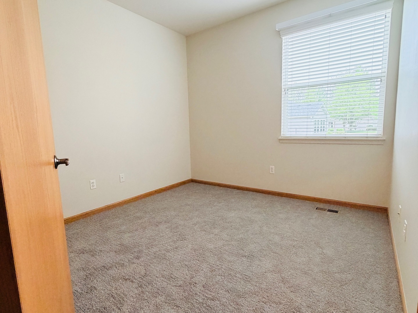 1534 Cadillac Circle Romeoville, IL 60446 - Photo 13 of 25 an empty room with a window