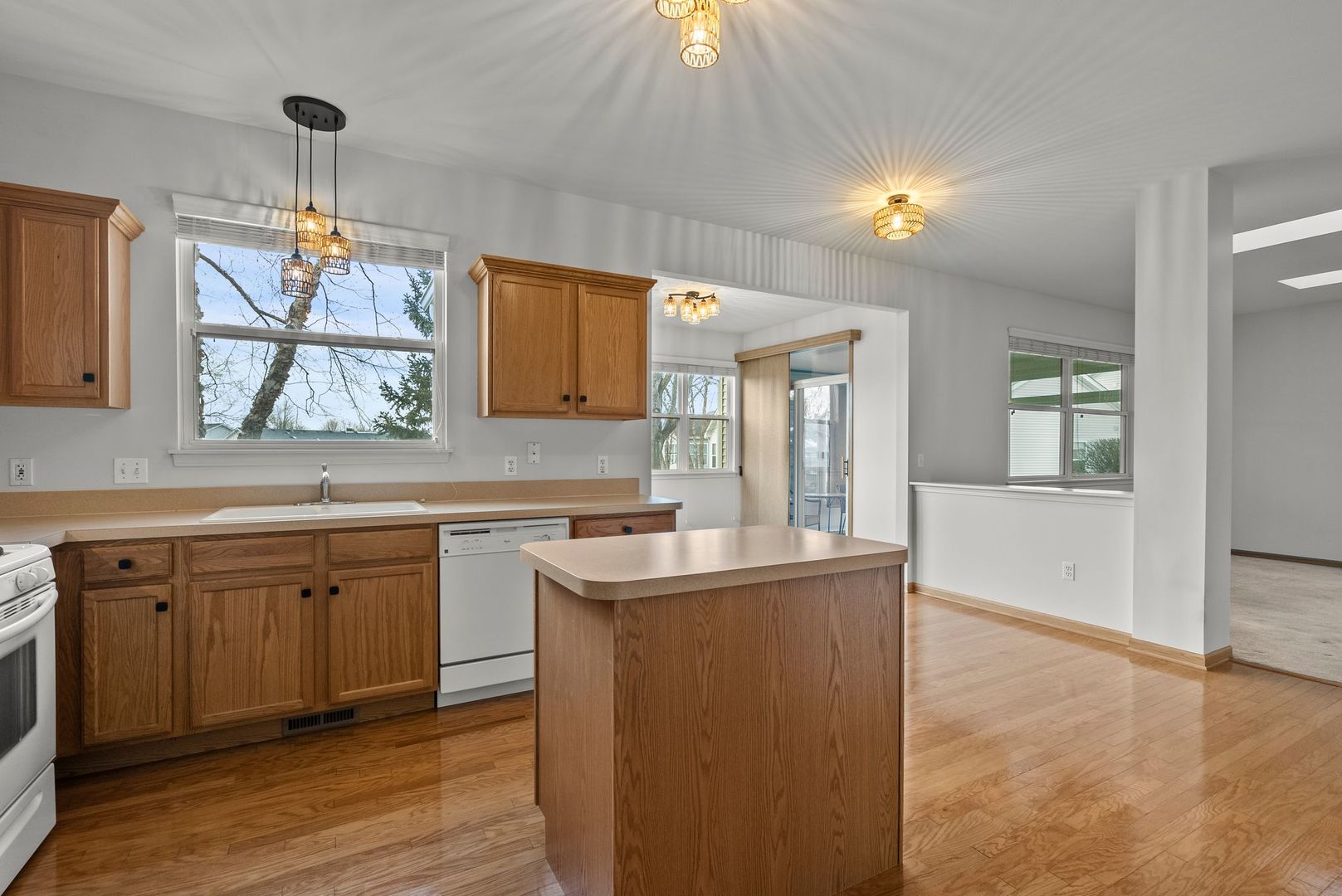 1534 Cadillac Circle Romeoville, IL 60446 - Photo 6 of 25 a kitchen with a sink cabinets and window