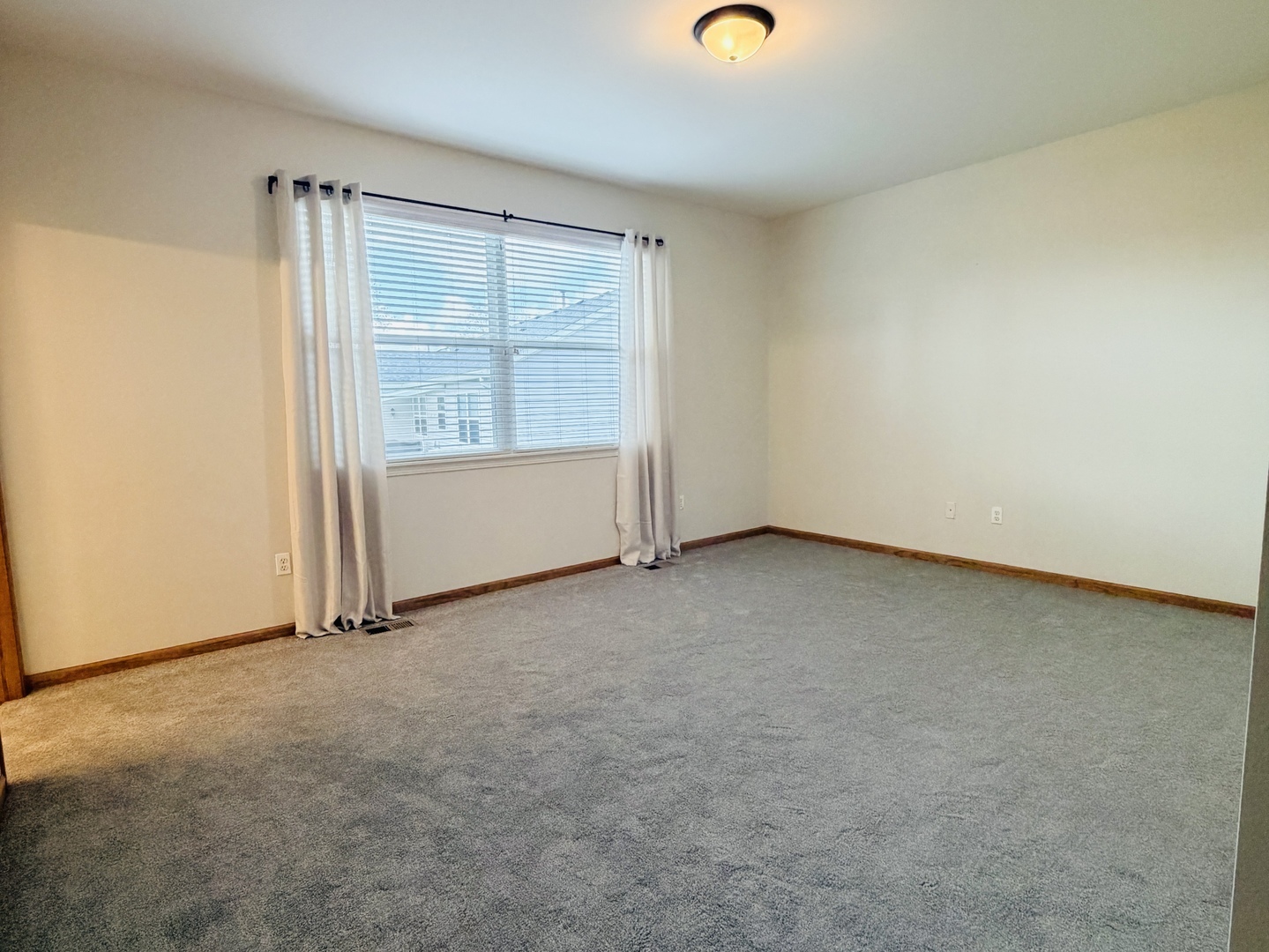 1534 Cadillac Circle Romeoville, IL 60446 - Photo 9 of 25 an empty room with a window