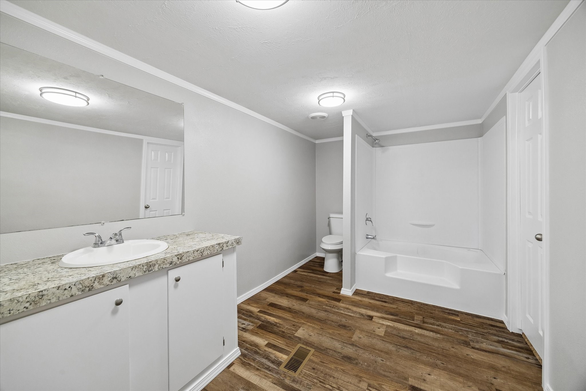 30 Timm Cleveland, TX 77327 - Photo 6 of 10 a bathroom with a granite countertop sink and a mirror
