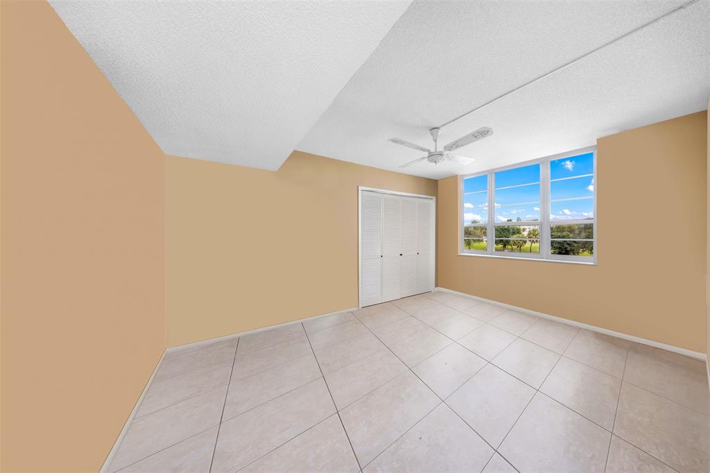 2681 South Course Drive, Unit 301 Pompano Beach, FL 33069 - Photo 12 of 27 a view of an empty room and window