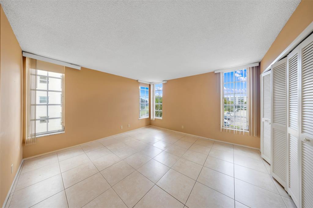 2681 South Course Drive, Unit 301 Pompano Beach, FL 33069 - Photo 14 of 27 a view of an empty room with a window