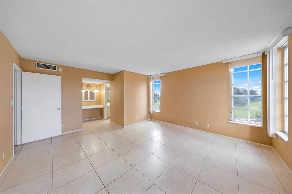 2681 South Course Drive, Unit 301 Pompano Beach, FL 33069 - Photo 15 of 27 a view of an empty room with a window