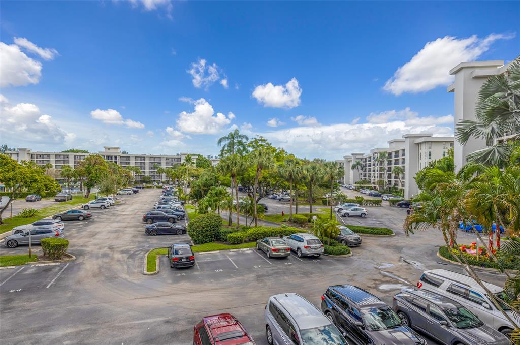 2681 South Course Drive, Unit 301 Pompano Beach, FL 33069 - Photo 23 of 27 a view of a parking area