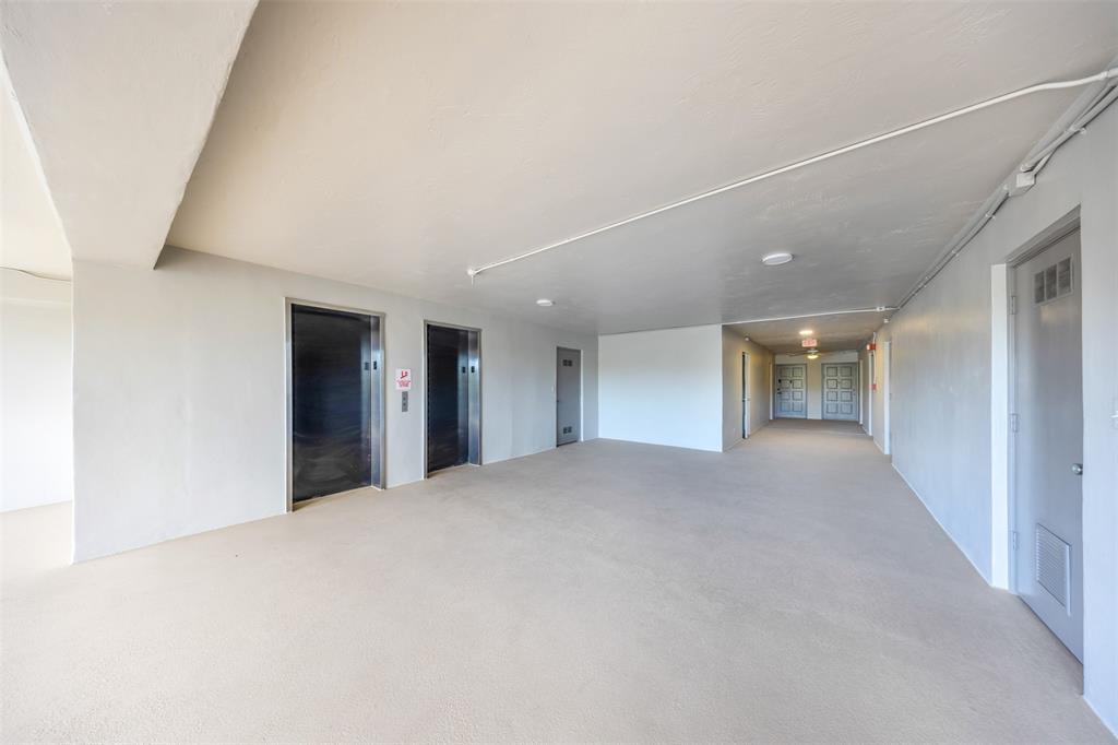 2681 South Course Drive, Unit 301 Pompano Beach, FL 33069 - Photo 24 of 27 a view of empty room with kitchen