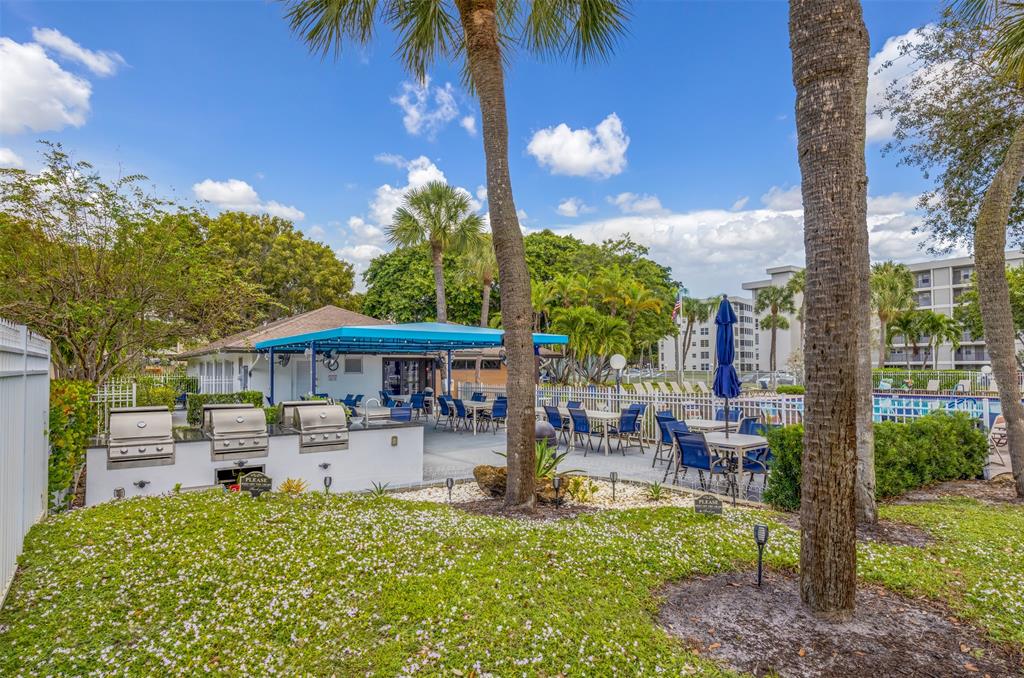 2681 South Course Drive, Unit 301 Pompano Beach, FL 33069 - Photo 27 of 27 a front view of a house with garden