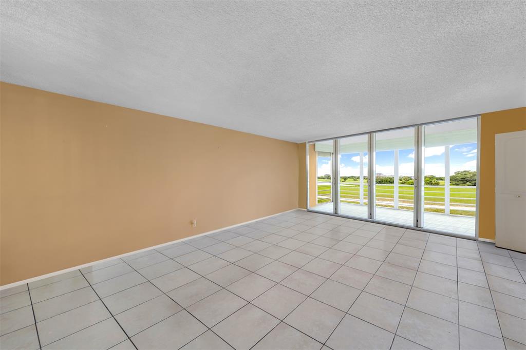 2681 South Course Drive, Unit 301 Pompano Beach, FL 33069 - Photo 5 of 27 a view of an empty room and window