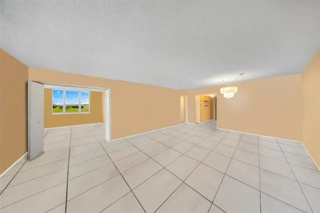 a view of an empty room and window