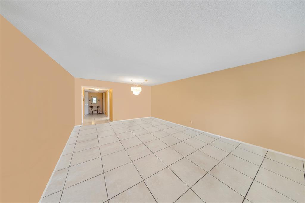 2681 South Course Drive, Unit 301 Pompano Beach, FL 33069 - Photo 8 of 27 a view of an empty room and window