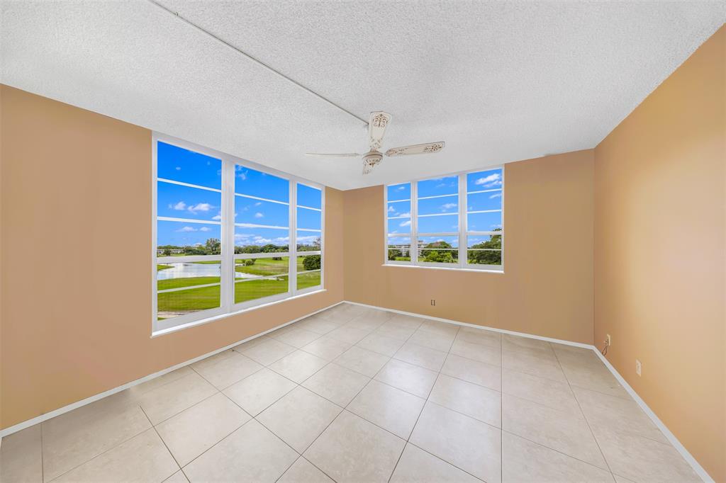 2681 South Course Drive, Unit 301 Pompano Beach, FL 33069 - Photo 9 of 27 a view of an empty room with a window