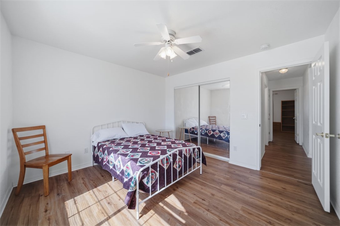 2144 Ridgeview Road Kingman, AZ 86401 - Photo 31 of 49 a bedroom with a bed and wooden floor
