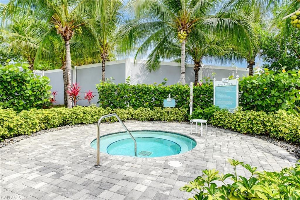 2620 Seychelles Circle, Unit 1302 Naples, FL 34112 - Photo 37 of 43 a view of a swimming pool with an outdoor space