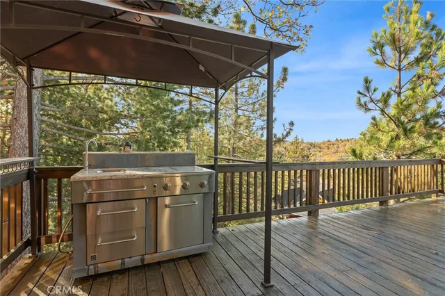 a view of a balcony with furniture and wooden floor