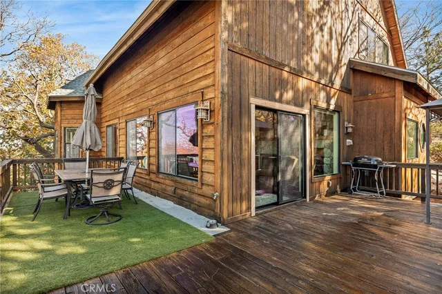 a view of a house with backyard porch and sitting area