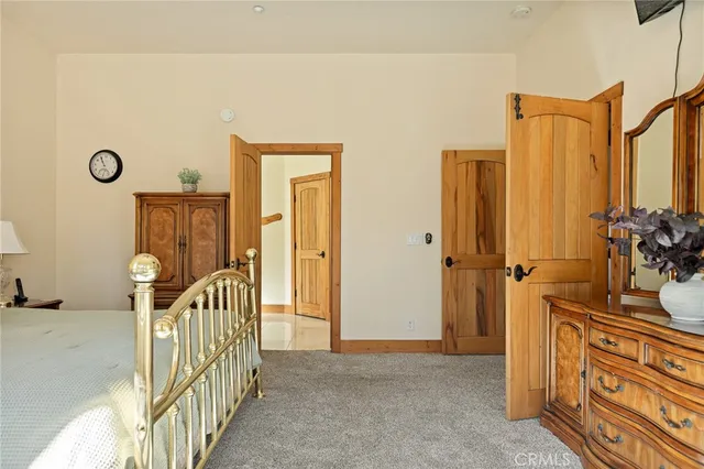 a bathroom with a granite countertop sink a mirror and a shower