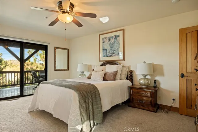 a bathroom with a granite countertop sink a toilet and a shower