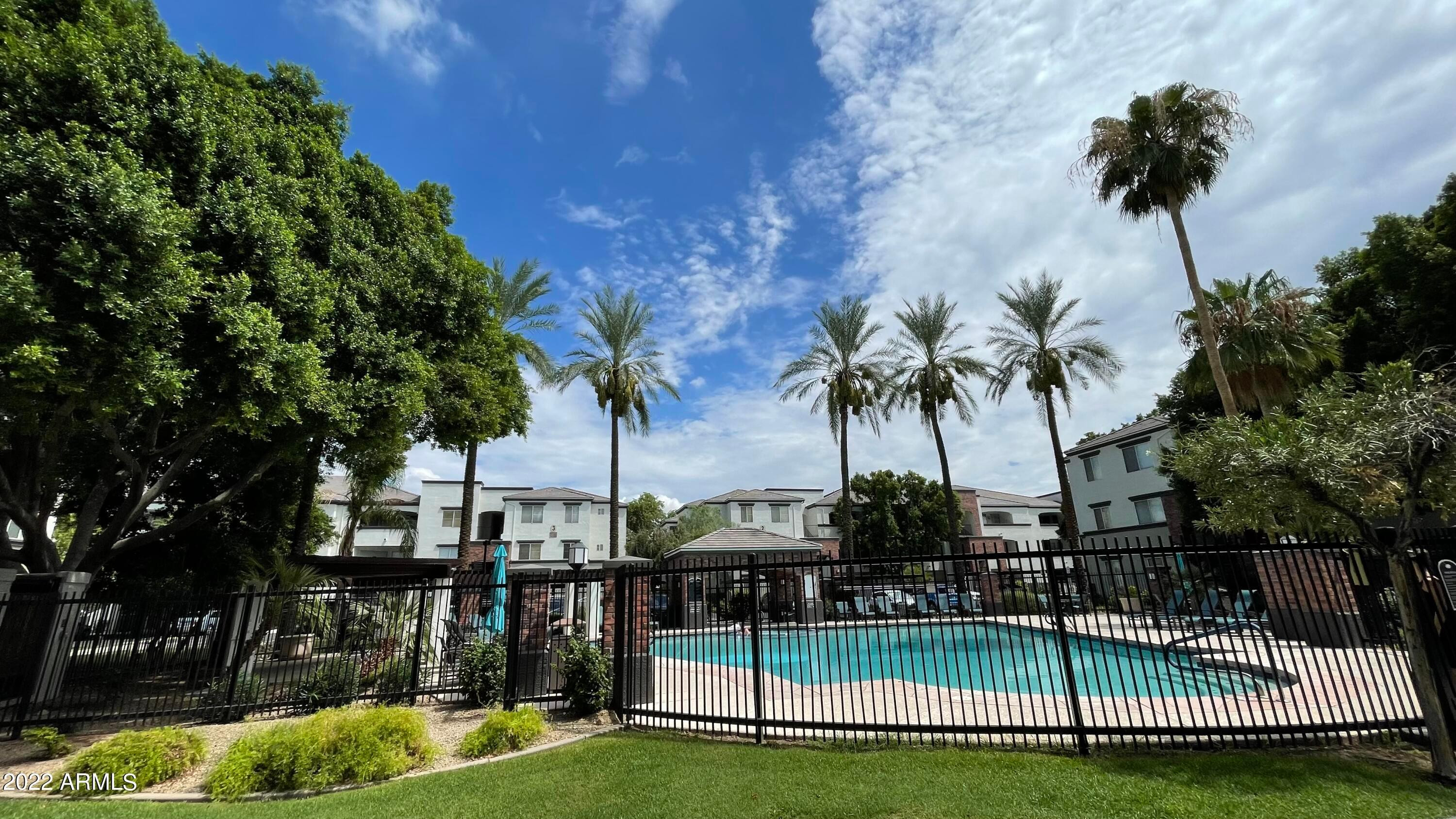 3302 North 7th Street, Unit 222 Phoenix, AZ 85014 - Photo 20 of 30 a view of a swimming pool with a garden