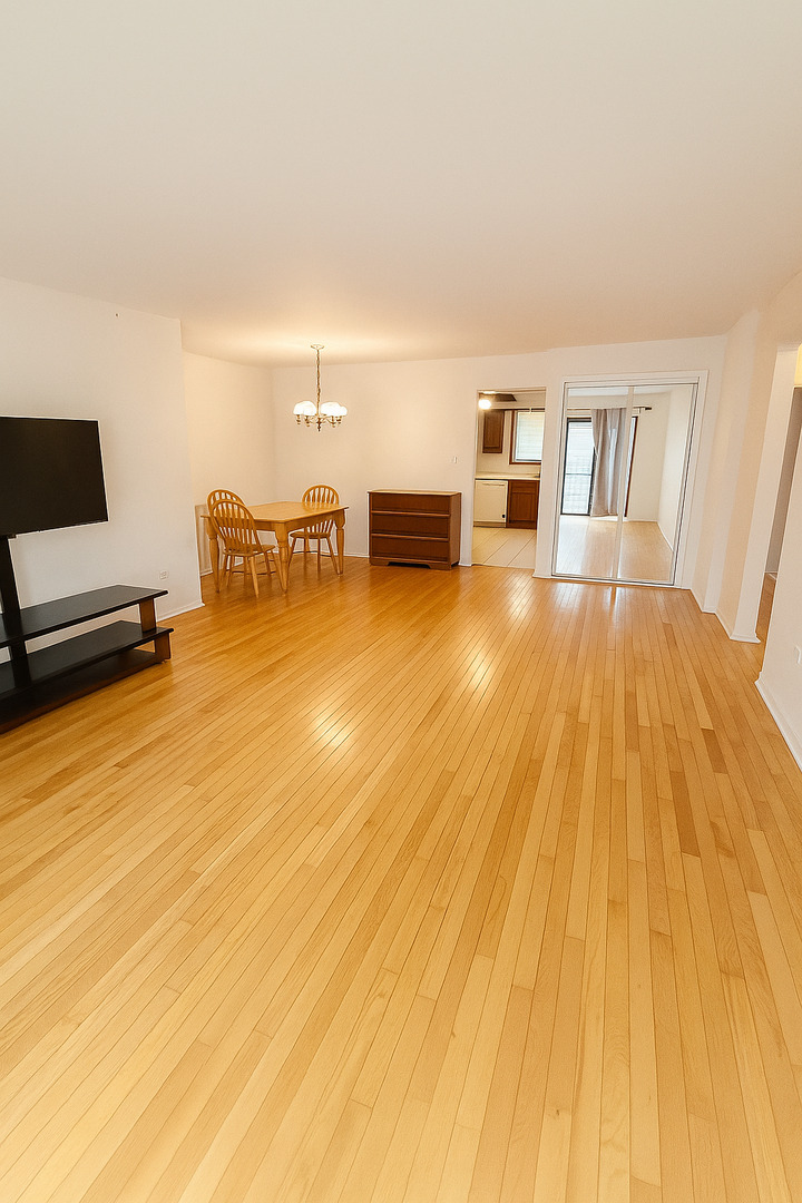 2139 North Harlem Avenue, Unit 224 Chicago, IL 60707 - Photo 4 of 18 a living room with furniture and a flat screen tv
