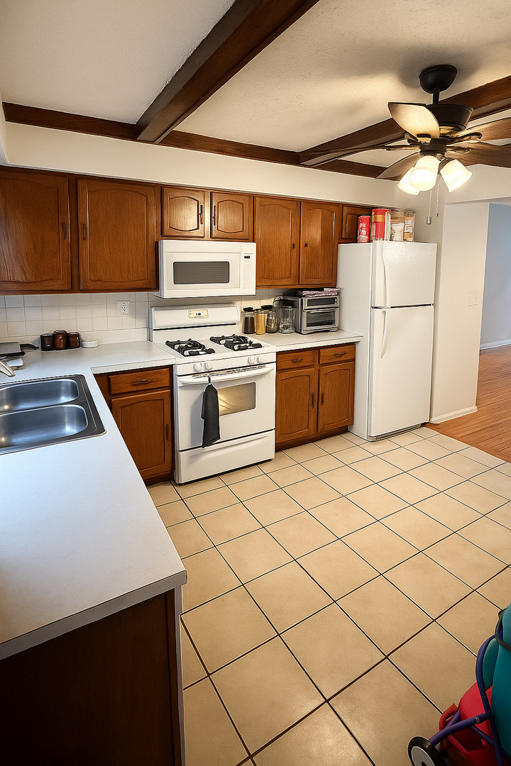 2139 North Harlem Avenue, Unit 224 Chicago, IL 60707 - Photo 8 of 18 a kitchen with stainless steel appliances granite countertop a sink and white cabinets