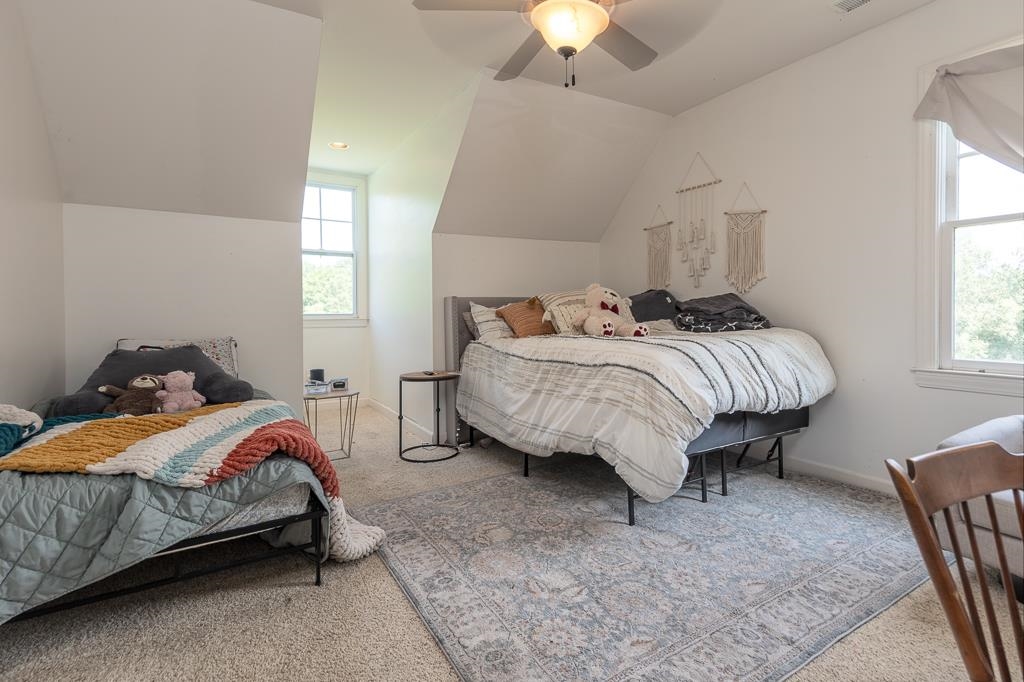 1915 Teague Store Road Somerville, TN 38068 - Photo 32 of 38 Carpeted room with sloped ceilings and white walls