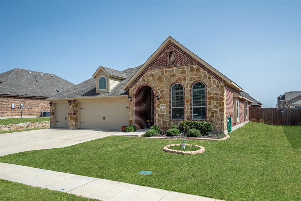 3724 Ranchers Ridge Krum, TX 76249 - Photo 3 of 32 Charming curb appeal with beautifully maintainedlandscaping!