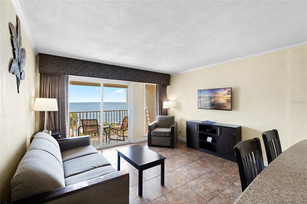 Undisclosed Address Tampa, FL 33607 - Photo 11 of 40 a living room with furniture and a large window