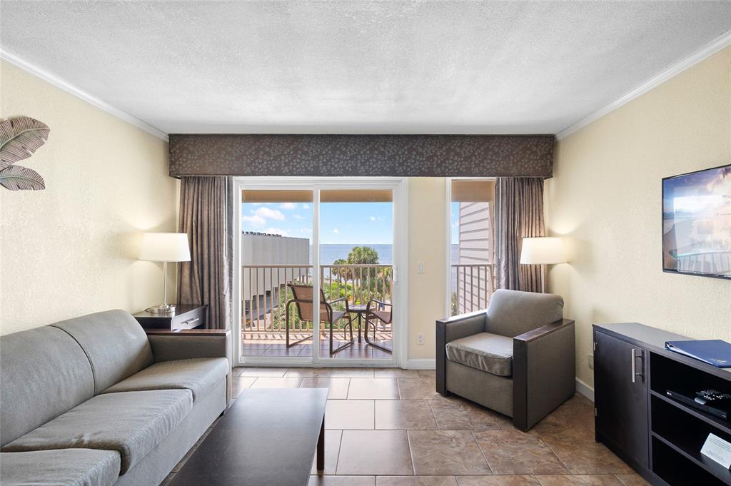 Undisclosed Address Tampa, FL 33607 - Photo 12 of 40 a living room with furniture and a large window