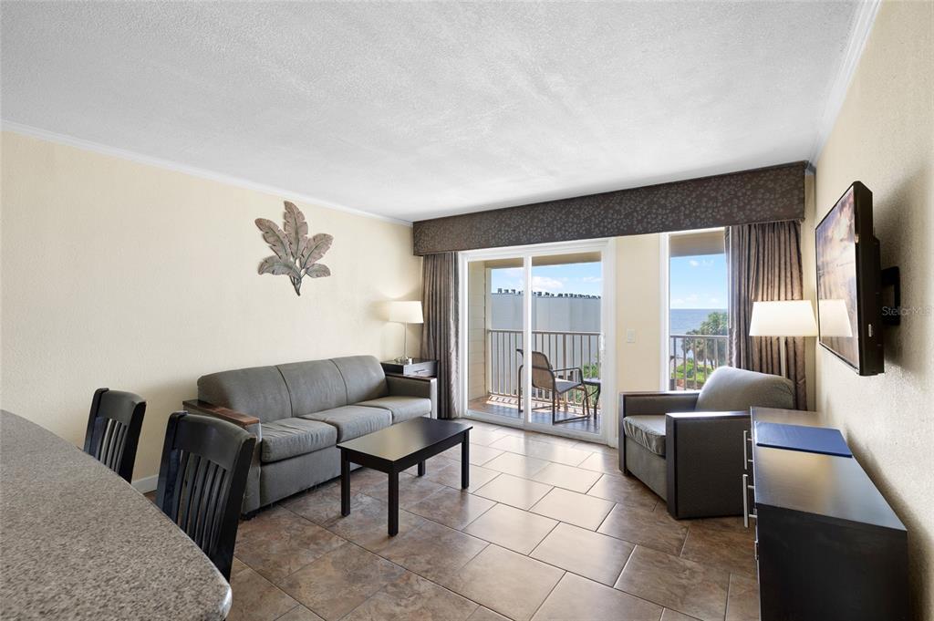 Undisclosed Address Tampa, FL 33607 - Photo 13 of 40 a living room with furniture and a flat screen tv