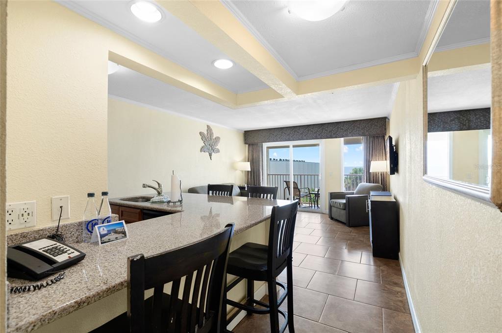 Undisclosed Address Tampa, FL 33607 - Photo 14 of 40 a dining room with furniture and wooden floor