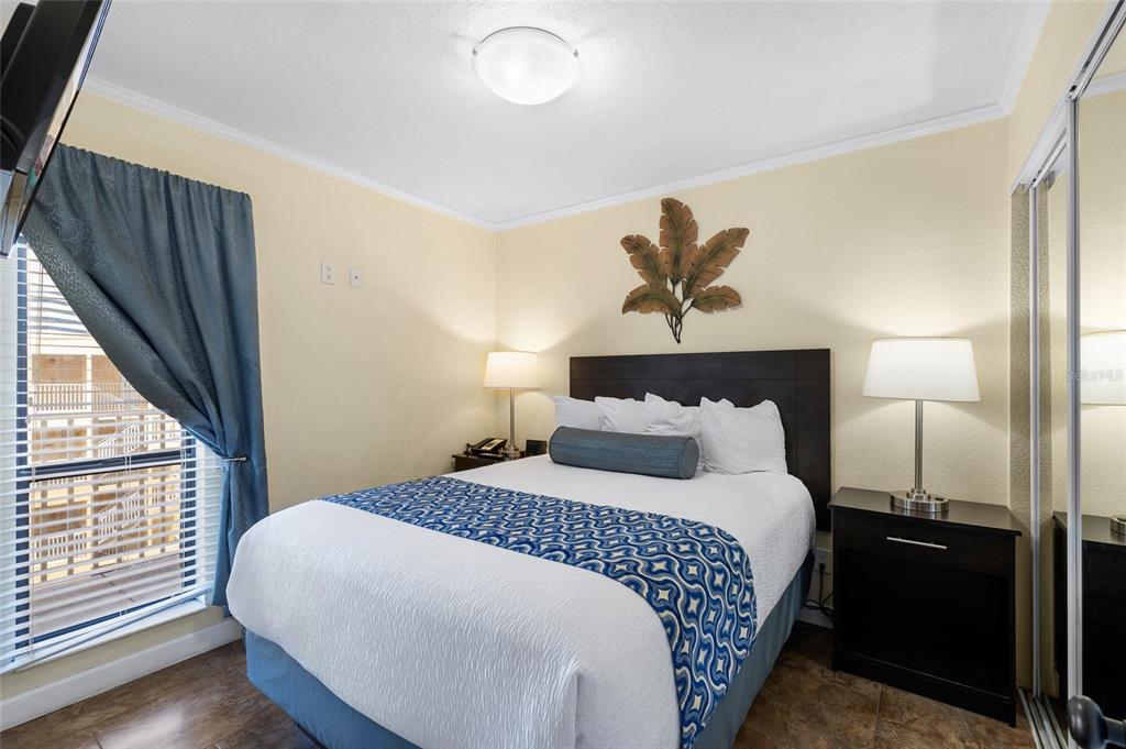 Undisclosed Address Tampa, FL 33607 - Photo 16 of 40 a bedroom with a bed and a window