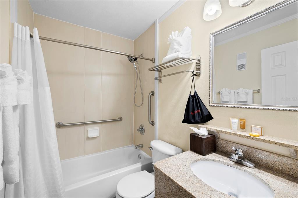 Undisclosed Address Tampa, FL 33607 - Photo 18 of 40 a bathroom with a sink toilet and shower